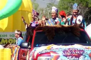 Left to right: Miss Native American U.S.A. Sarah Ortegon (Eastern Shoshone), Miss Indian World Taylor Thomas (Shoshone-Bannock), and Miss Indian Nations Alexandra Alvarez in a float at Eastern Shoshone Days. Organizers said it was special to have all three title-holders from the national pageants at the powwow, and for all three to be of Shoshone descent. (Gregory Nickerson/WyoFile)